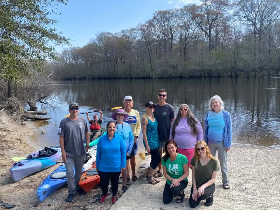 Carolina Splash Mob paddlers gathered beside the Edisto River